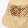 Anagram-Bucket-Hat aus Raffia und Kalbsleder Anagram-Bucket-Hat aus Raffia und Kalbsleder