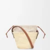 Bucket-Bag mit Kordelzug aus Palmblättern und Kalbsleder Bucket-Bag mit Kordelzug aus Palmblättern und Kalbsleder