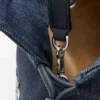 „Cats“ Flamenco-Clutch in mittlerer Größe aus besticktem Denim