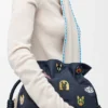 „Cats“ Flamenco-Clutch in mittlerer Größe aus besticktem Denim