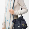 „Cats“ Flamenco-Clutch in mittlerer Größe aus besticktem Denim