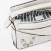 „Futurist Cat“ Mini Puzzle-Tasche aus klassischem Kalbsleder „Futurist Cat“ Mini Puzzle-Tasche aus klassischem Kalbsleder