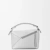 Kleine „Puzzle Edge“-Tasche aus laminiertem Lammleder Kleine „Puzzle Edge“-Tasche aus laminiertem Lammleder