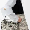 Kleine „Puzzle“-Tasche aus gewebtem Textil Kleine „Puzzle“-Tasche aus gewebtem Textil