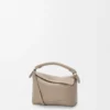 Mini Puzzle Edge Tasche aus weichem, genarbtem Kalbsleder Mini Puzzle Edge Tasche aus weichem, genarbtem Kalbsleder
