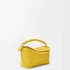 Mini Puzzle Edge Tasche aus weichem, genarbtem Kalbsleder Mini Puzzle Edge Tasche aus weichem, genarbtem Kalbsleder