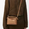 Mini Puzzle Edge Tasche aus weichem, genarbtem Kalbsleder Mini Puzzle Edge Tasche aus weichem, genarbtem Kalbsleder