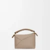 Mini Puzzle Edge Tasche aus weichem, genarbtem Kalbsleder Mini Puzzle Edge Tasche aus weichem, genarbtem Kalbsleder