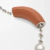 Mini-Squeeze-Tasche aus perlenverziertem Leder Mini-Squeeze-Tasche aus perlenverziertem Leder