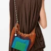 Mini-Squeeze-Tasche aus perlenverziertem Leder Mini-Squeeze-Tasche aus perlenverziertem Leder