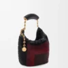 Mini-Squeeze-Tasche aus perlenverziertem Leder Mini-Squeeze-Tasche aus perlenverziertem Leder