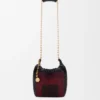 Mini-Squeeze-Tasche aus perlenverziertem Leder Mini-Squeeze-Tasche aus perlenverziertem Leder
