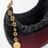 Mini-Squeeze-Tasche aus perlenverziertem Leder Mini-Squeeze-Tasche aus perlenverziertem Leder