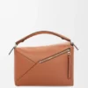 Mittlere „Puzzle Edge“-Tasche aus klassischem Kalbsleder Mittlere „Puzzle Edge“-Tasche aus klassischem Kalbsleder