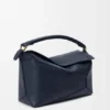Mittlere „Puzzle Edge“-Tasche aus weichem, genarbtem Kalbsleder Mittlere „Puzzle Edge“-Tasche aus weichem, genarbtem Kalbsleder