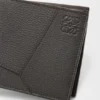 Puzzle-Portemonnaie im Zweifach-Format aus geschmeidigem, genarbtem Kalbsleder Puzzle-Portemonnaie im Zweifach-Format aus geschmeidigem, genarbtem Kalbsleder