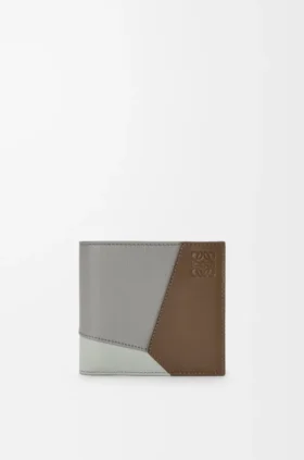 Puzzle-Portemonnaie zum Aufklappen aus klassischem Kalbsleder Puzzle-Portemonnaie zum Aufklappen aus klassischem Kalbsleder