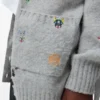 Strickjacke mit Gürtel aus Wolle Strickjacke mit Gürtel aus Wolle