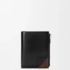 Switch Slim Compact Portemonnaie aus geschmeidigem genarbtem Kalbsleder und Wildleder Switch Slim Compact Portemonnaie aus geschmeidigem genarbtem Kalbsleder und Wildleder
